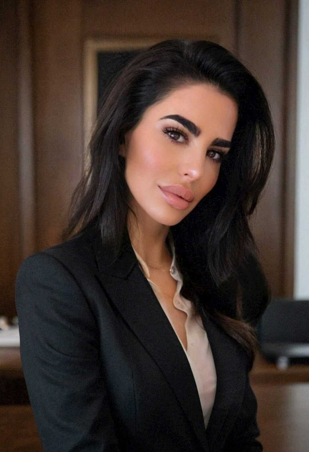 Studio portrait of a Turkish woman lawyer in business attire